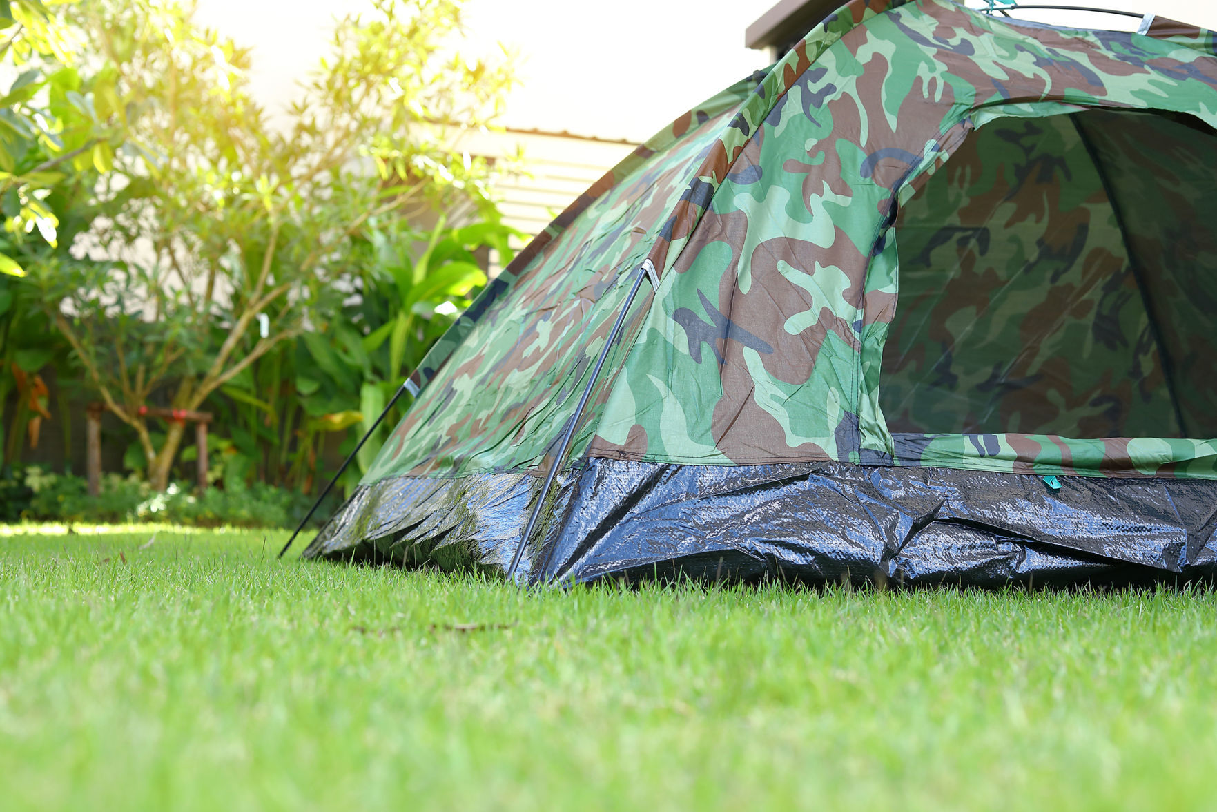 tent camping on green grass lawn campsite, equipment for trip backpack travel in nature